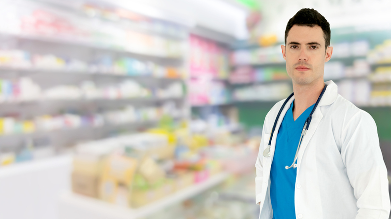 Young male pharmacist working at the pharmacy